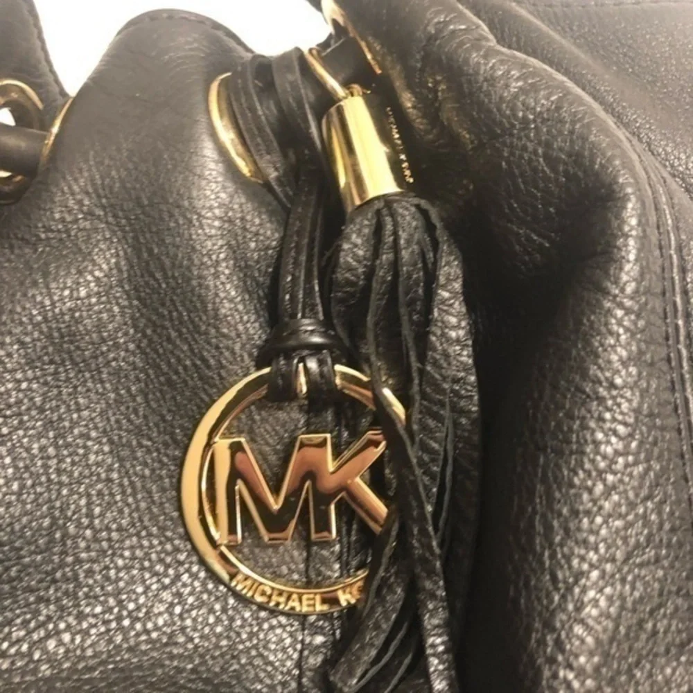 Michael kors black leather ringed tassel bag